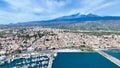 Riposto - vista aerea dall'alto sul porto della cittÃÂ  durante giornata di sole con Etna sullo sfondo